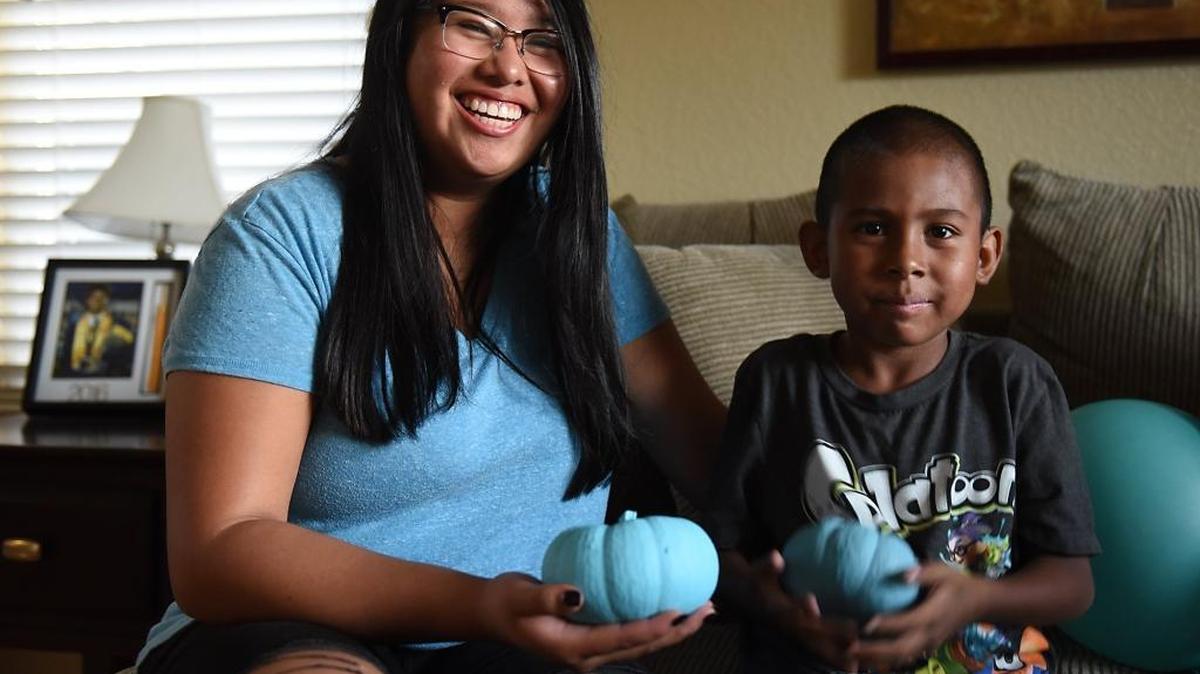 Arieana Mabugat, a student at Beyer High, is pictured Tuesday evening, October 26, 2016, with her nephew Jace Taa, 3, in Salida, Calif. Mabugat supports the Teal Pumpkin Project inspired by Jace and his multiple food allergies. The project has people offer nonedible treats on Halloween.