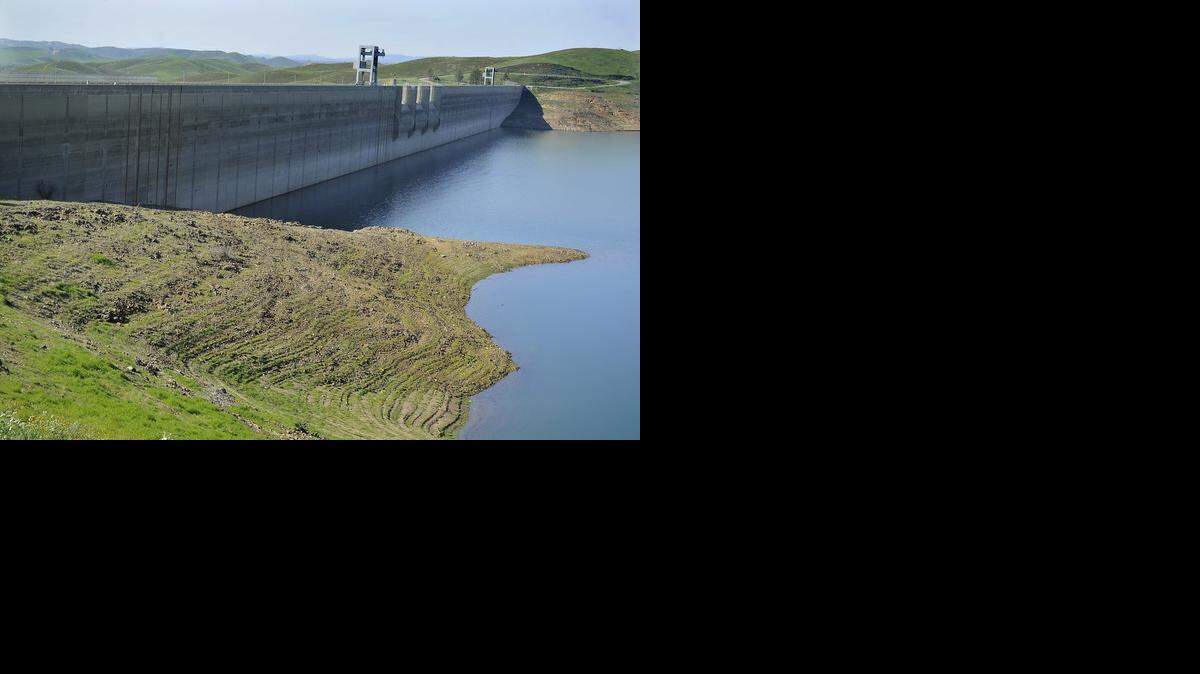 Friant Dam, part of the federal Central Valley Project, rises high above Millerton Lake. There are more claims for federal and state water than there is supply.