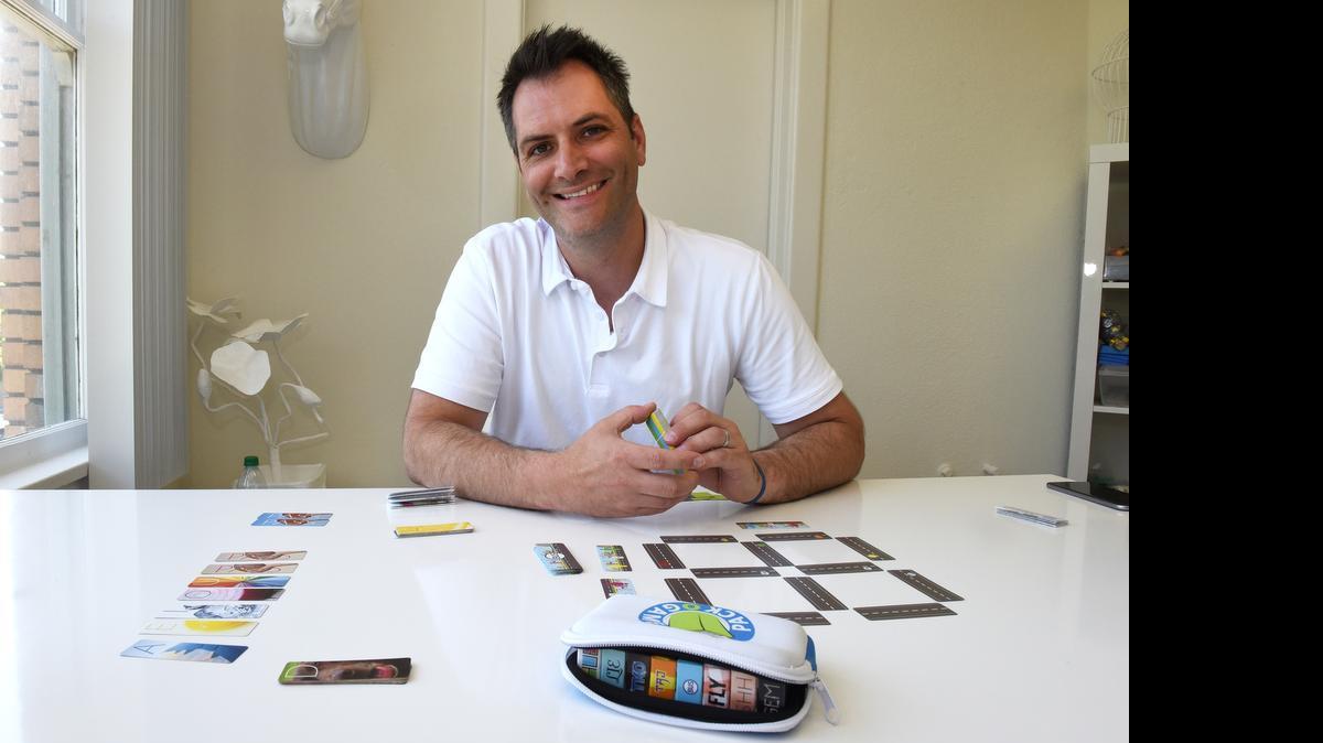 
Game maker Chris Handy, maker of the Pack O Game line of eight mini card games, hangs out in his Turlock office Wednesday morning.
