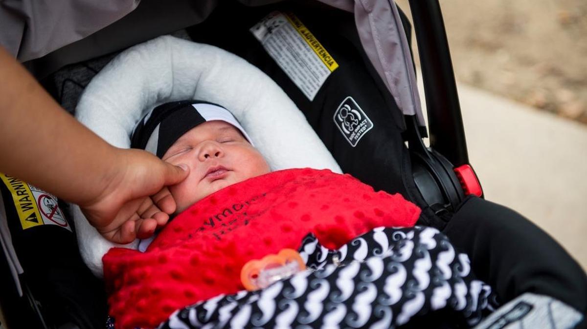 Big brother Rogelio Reyes IV, 11, touches the cheek of his new baby brother Raymond Jay Reyes outside Valley Children's Hospital in Madera, Calif., on Saturday, May 6, 2017. Raymond Jay Reyes was born at Mercy Medical Center in Merced, Calif., on April 30, 2017 weighing 13 pounds, five ounces. Raymond was admitted to Valley Children's Hospital after experiencing multiple health complications such as respiratory distress, low sodium and low calcium levels. He was released from Valley Children's Hospital Saturday afternoon.