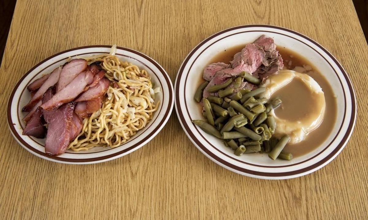 BBQ pork and chow mien combo plate and the roast beef and mashed potatoes with beans at Noah’s Hof Brau.