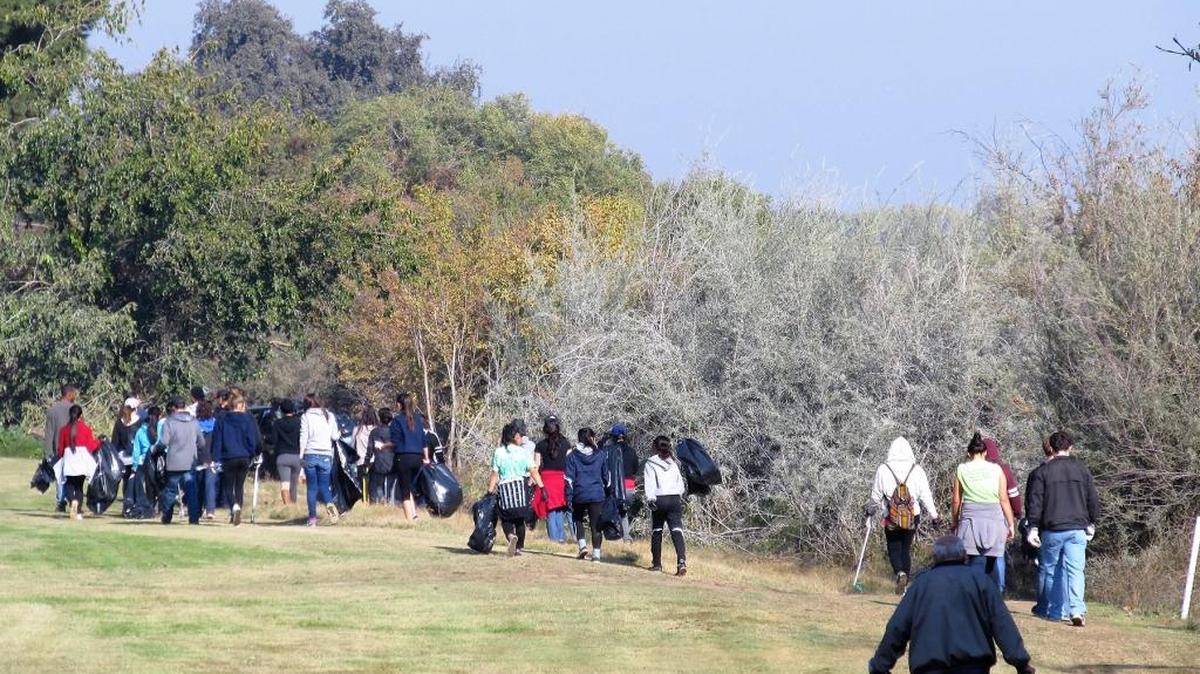 Volunteers with Operation 9-2-99 work on the Tuolumne River cleanup in Modesto on Nov. 28. The next cleanup is Dec. 12.