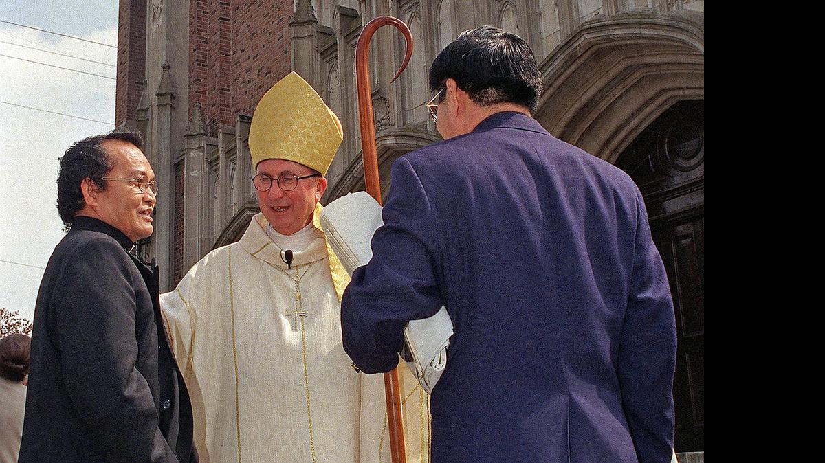 
The Rev. Editho Mascardo, left, meets with the Most Rev. Stephen Blaire and Hung Nguyen in 1999. On Friday, Blaire announced that Mascardo had been placed on administrative leave.
