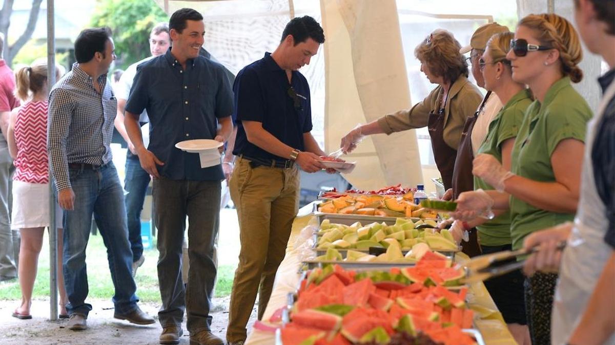 
The 54th annual Harvest Luncheon, which raises scholarship money for Modesto Junior College agriculture students, took place Friday (09-11-15) at Graceada Park in Modesto, Calif. Eric Tetrault of Modesto is served by Pat Gillum.
