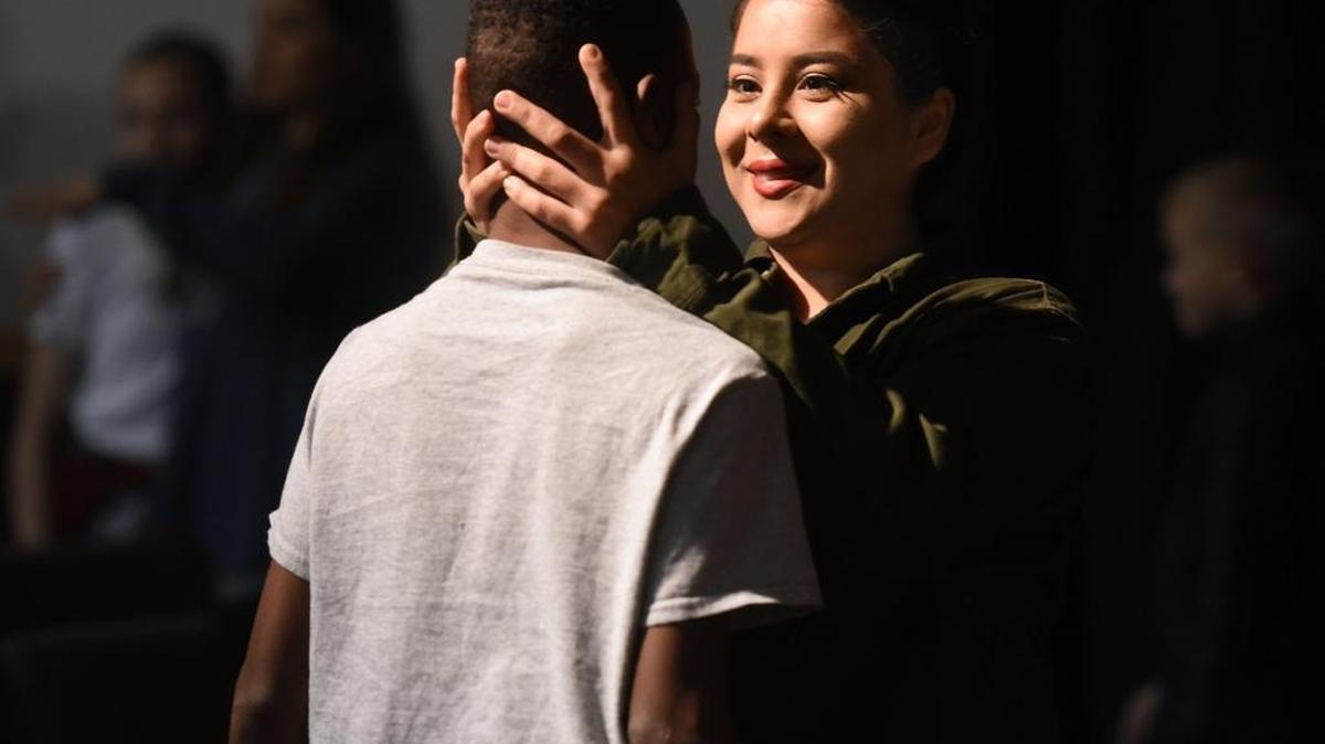Dance teacher Estrella Isiordia gives encouragement to Xavion Mason 11yrs just before the two perform with the CUPS dancers Monday morning January 15, 2018 during the Dr. Martin Luther King Remembrance Service at Westside Ministries in Turlock, Calif.