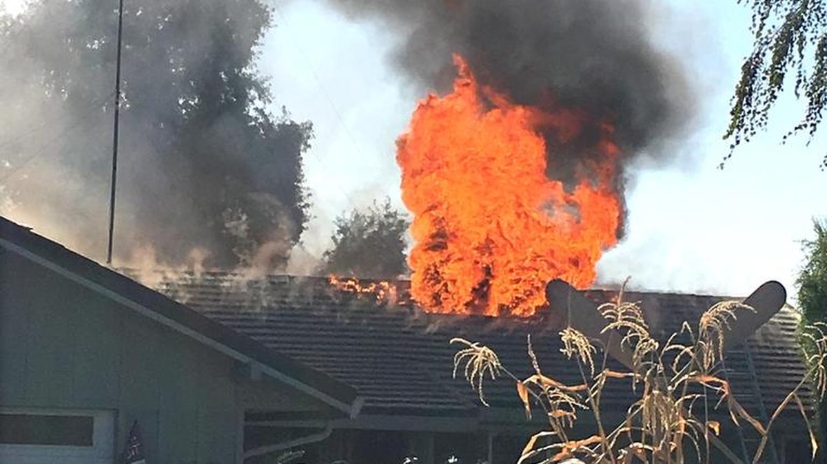 Stanislaus Consolidated Fire Protection District battles a house fire on Davidson Road east of Empire, Calif. on Friday (10-13-17).