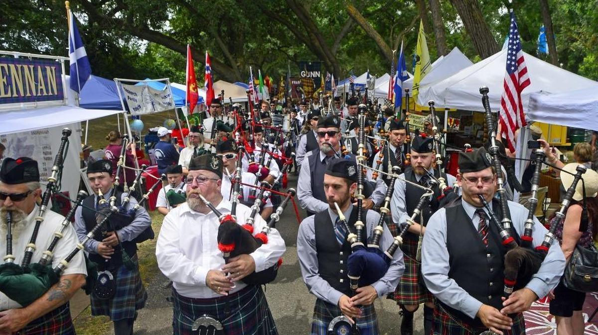 Bagpipers march through the middle of the festival during the 35th annual Modesto Scottish Highland Games & Celtic Festival at Tuolumne River Regional Park in Modesto, Calif., on June 4, 2016.