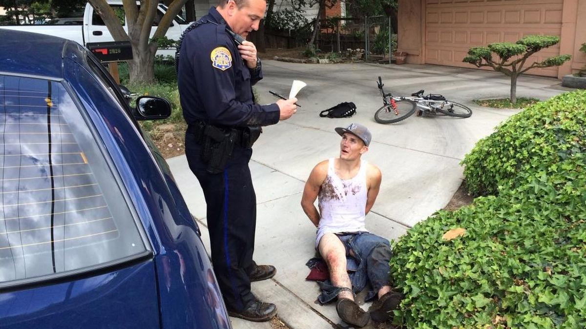 Modesto Police officer Mike Pershall is pictured with suspect David Luque on May 5, 2014. A resident called 911 to report he was following a male who was in his neighbor’s backyard and was now riding a bicycle out of the area. The resident followed the suspect to the 2000 block of Scenic Drive where he was seen going into the back yard of another residence. Pershall quickly arrived in the area and saw Luque standing on the front porch. Luque started to go along with Pershall’s commands, but then got up and ran toward the river. The officer and the resident chased Luque through the river and were able to apprehend him near the Dry Creek Trail.