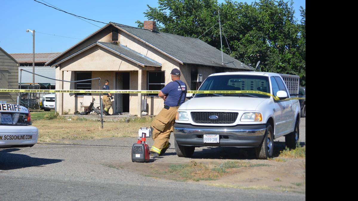
Firefighters examine the aftermath of a fire that broke out overnight at a home on Berkeley Road just outside Hughson. Firefighters were on scene Monday morning.
