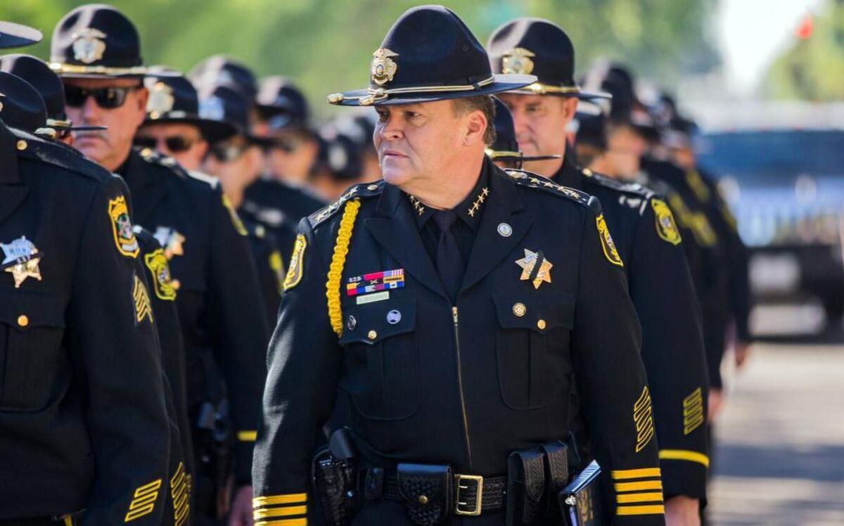 Stanislaus County Sheriff Adam Christianson is pictured in formation with his deputies at funeral services (05-23-17) for deputy Jason Garner at CrossPoint Community Church in Modesto, Calif.
