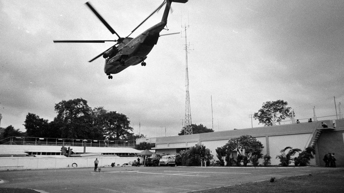 A helicopter lifts off from the U.S. embassy in Saigon, Vietnam, during last-minute evacuation of authorized personnel and civilians in April 1975.
