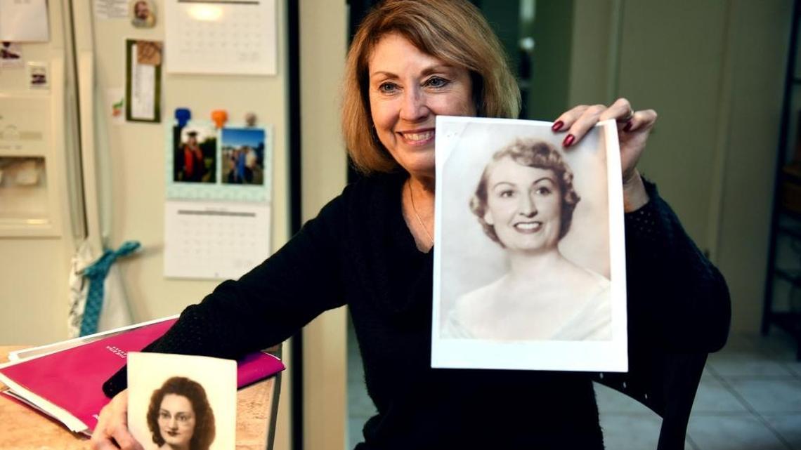 Debbie Albino of Modesto spent 37 years searching for her birth parents and found them using DNA. She is pictured Wednesday with pictures of her aunt Lucy Sides, left, and her mother Isabell Sides.