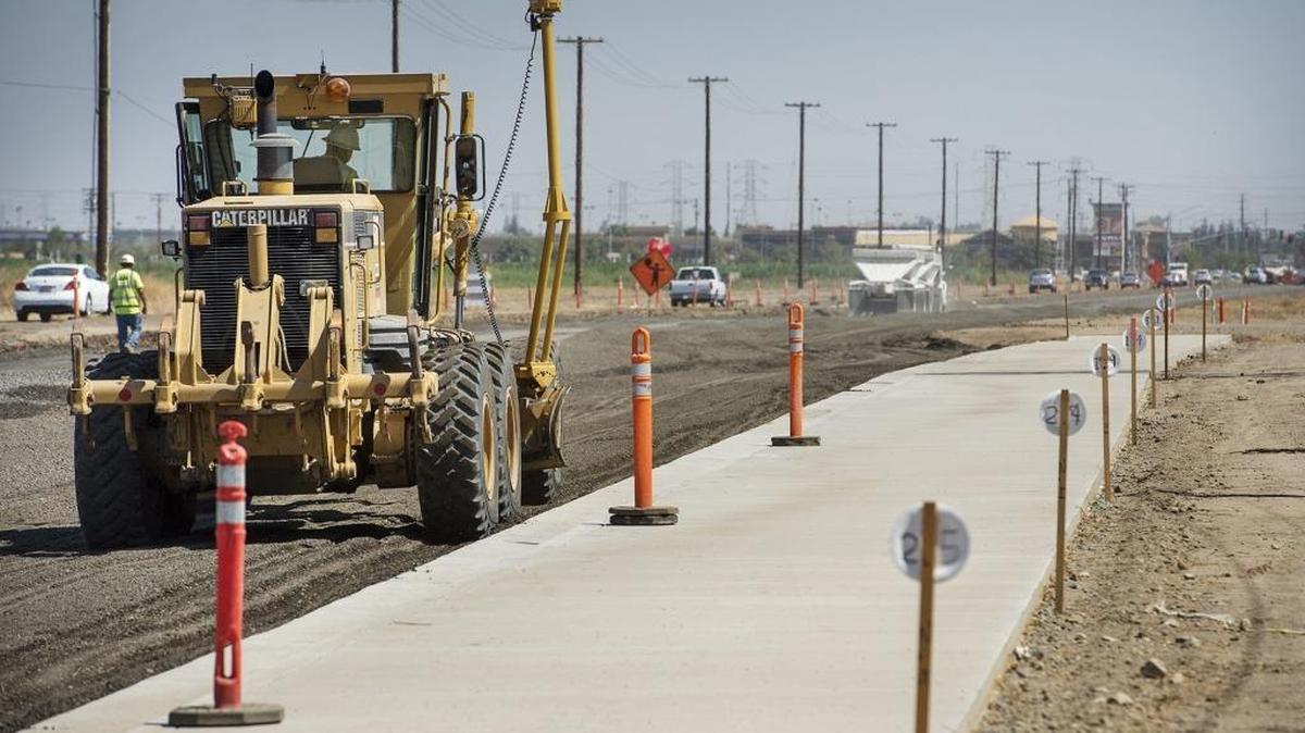 
Construction crews level and grade the expanded Claribel Road in Modesto on Wednesday.

