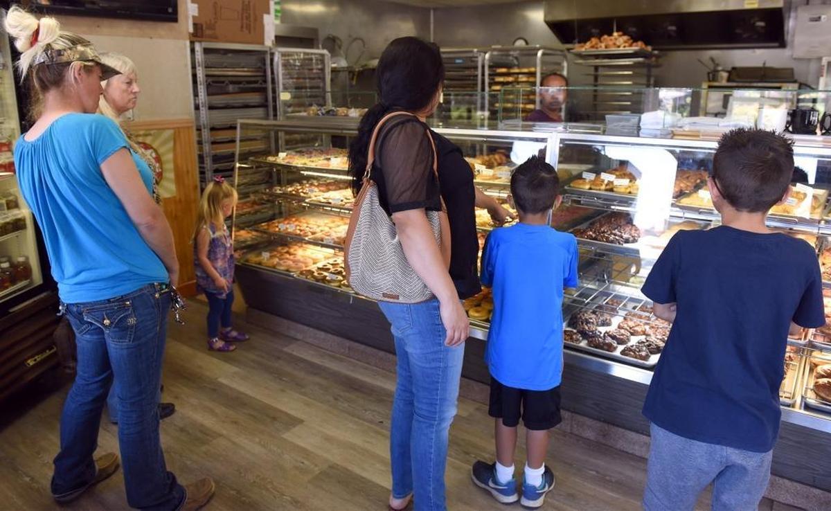 Customers order doughnuts on Monday afternoon (06-05-17) at Mr. T’s Delicate Donut in Modesto, Calif.
