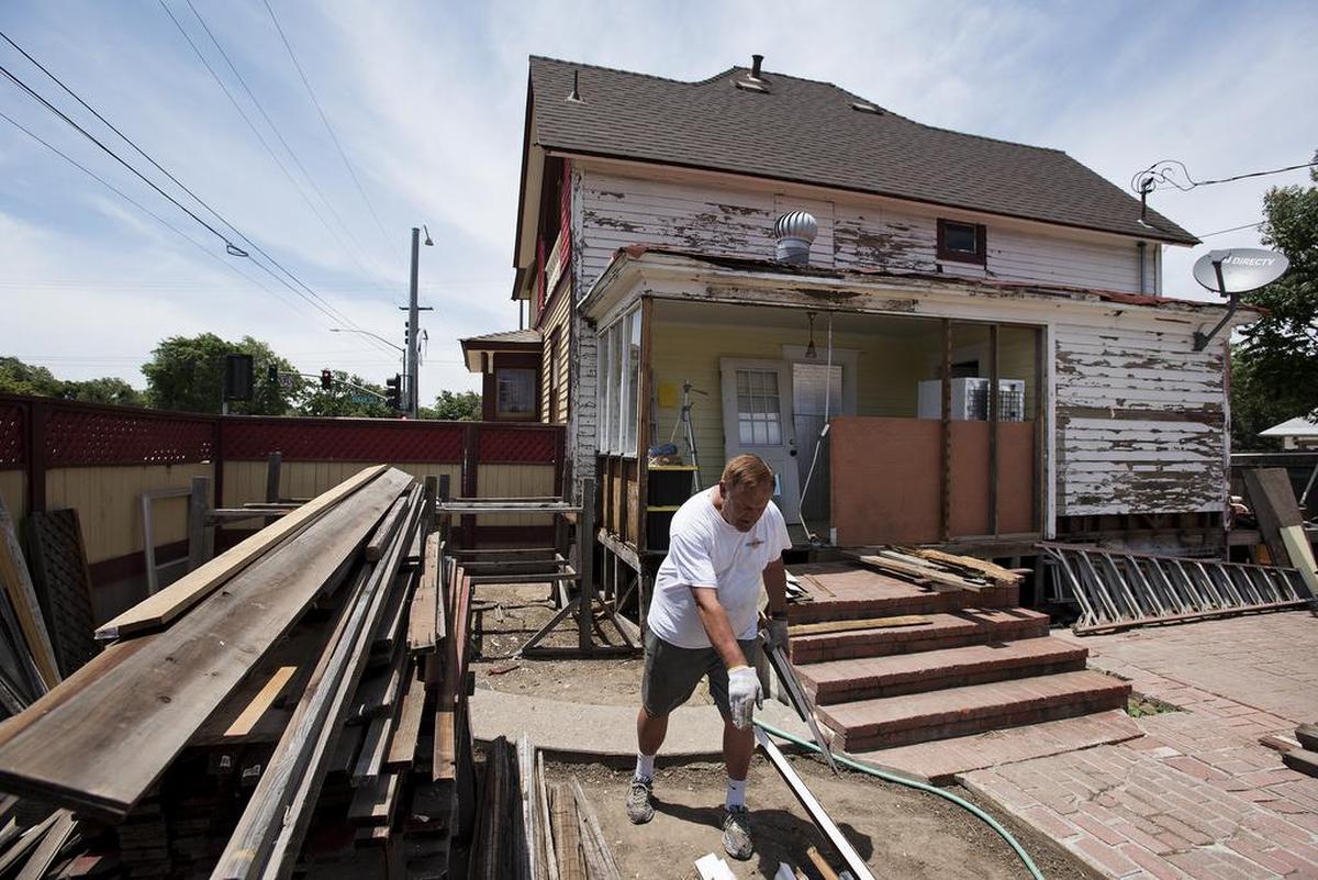 Former homeowner James Dietrich works in the backyard of his recently painted Queen Anne-style Victorian at Orangeburg and Tully in Modesto, in 2017.