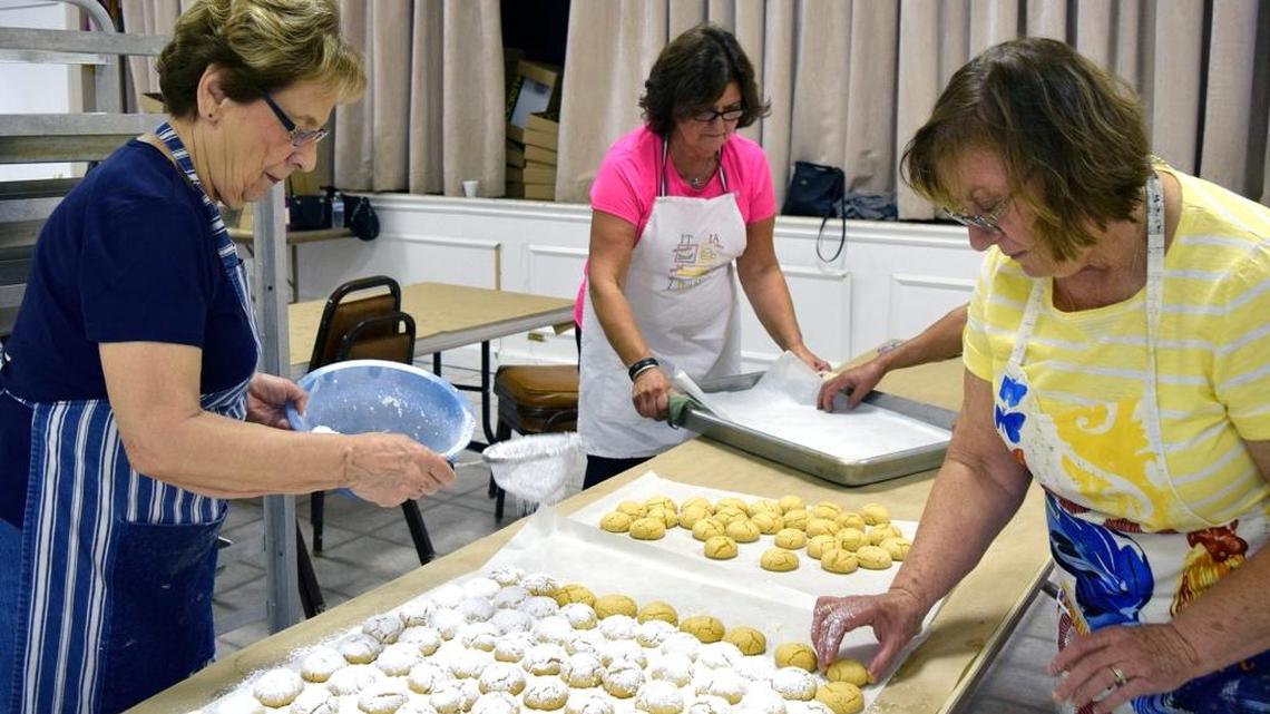 Members of Modesto’s Greek Orthodox Church of the Annunciation are baking, baking, baking to get ready for this weekend’s Greek Food Festival. Here, Sophie Pallios sprinkles powdered sugar over freshly baked walnut sugar cookies, called kourabiedes.