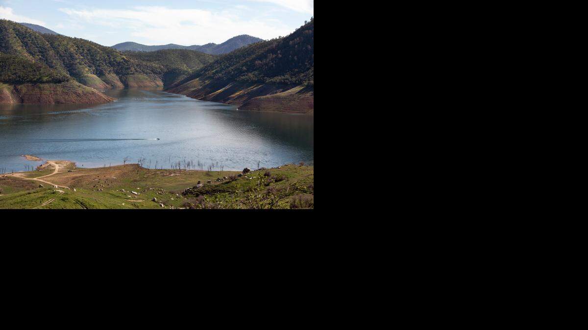 
Rings of previous water levels mark the hills at Pine Flat Lake in Piedra last week. With many reservoirs low, the state has added restrictions on urban water use.
