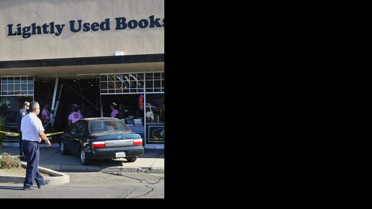 
The car is pulled out of the store front of Lightly Used Books after a driver crashed through it in the 100 block of North Center Street in Turlock on Tuesday morning. No major injuries were reported.
