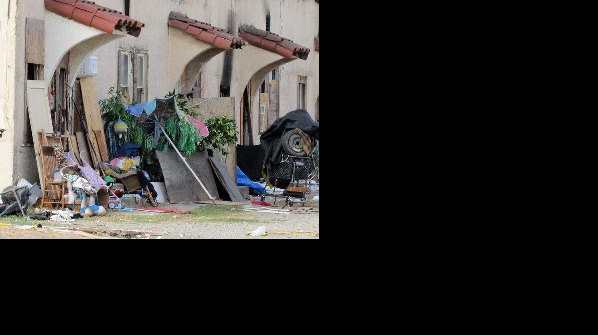 
Trash surrounds apartments on McHenry Avenue in Modesto. The property is on the market for $2.1 million and is next door to a Lexus dealership.
