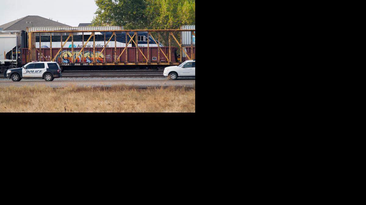 
Authorities on scene as photographed from Kentucky Avenue looking west, investigating in Riverbank after a man died after being hit by an Amtrak train Friday, Oct. 31, 2014.
