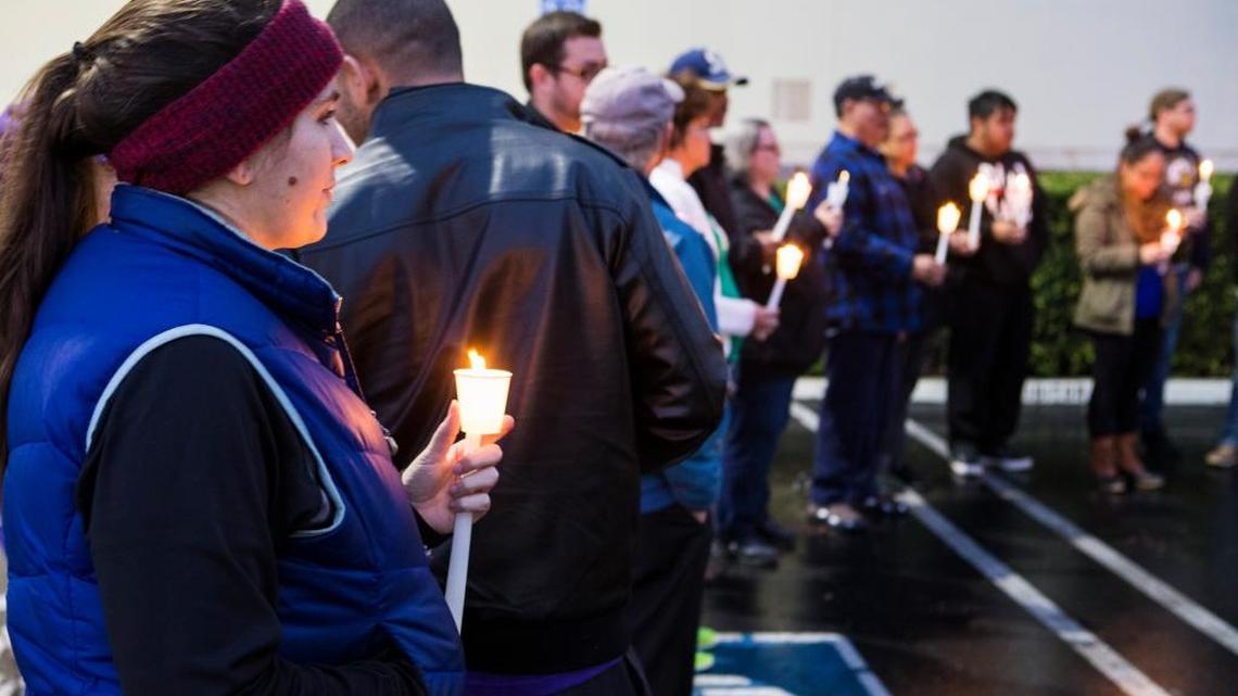 Sarah Hunt of Modesto joins advocates for the Affordable Care Act standing outside Rep. Jeff Denham’s office Thursday in Modesto, calling on him not to repeal the ACA without a replacement plan.