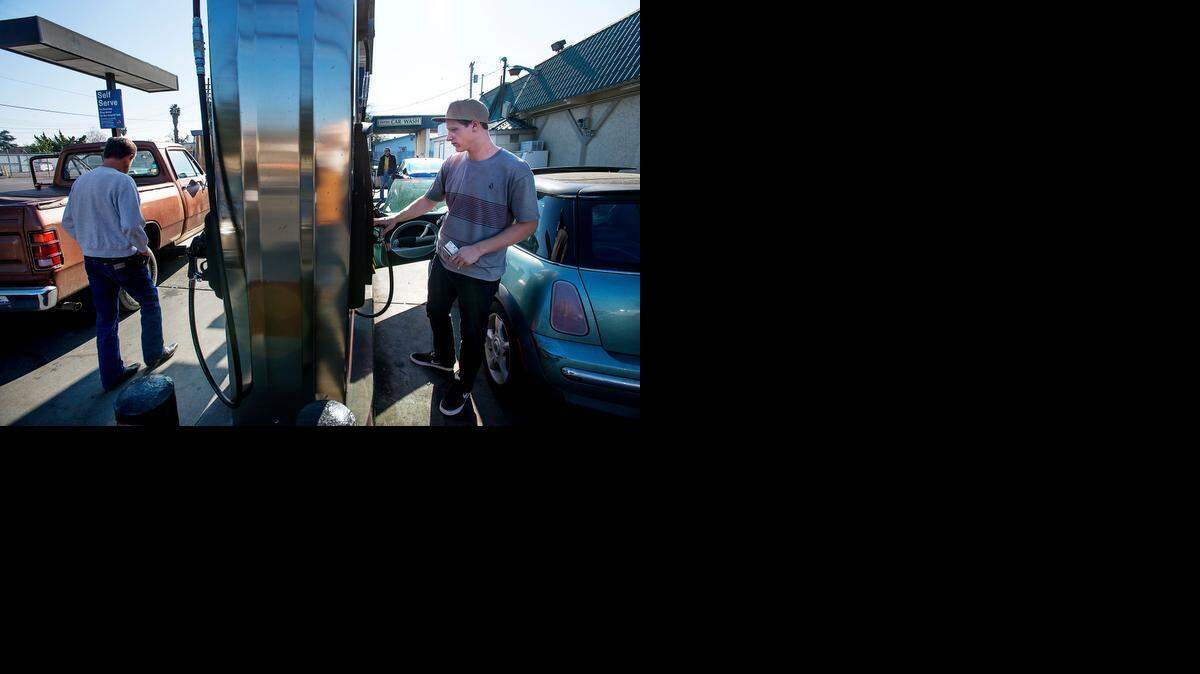 
Sean Dunkirk of Waterford fills up with gas at Fastrip near Empire Liquors on Saturday. A gallon of unleaded was $2.19.
