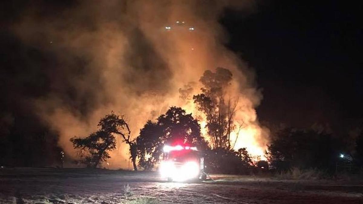Firefighters battled a blaze late Thursday (July 13, 2017) as flames burned piles of wood shavings at a facility in French Camp, Calif.