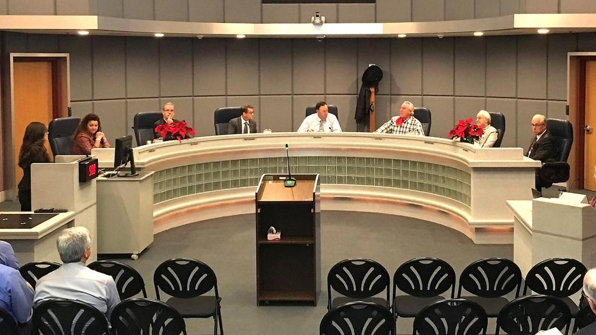 From the left on the dais, General Counsel Ronda Lucas, Modesto Irrigation District Board members Stu Gilman, Paul Campbell, Nick Blom, Larry Byrd, John Mensinger, and General Manager Scott Furgerson on Dec. 5, 2017.