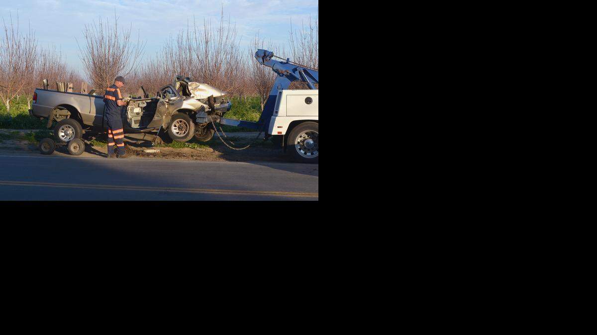 
A tow truck operator hooks up a truck following a fatal accident at Gratton and Tuolumne in Denair Monday. January 12, 2015.

