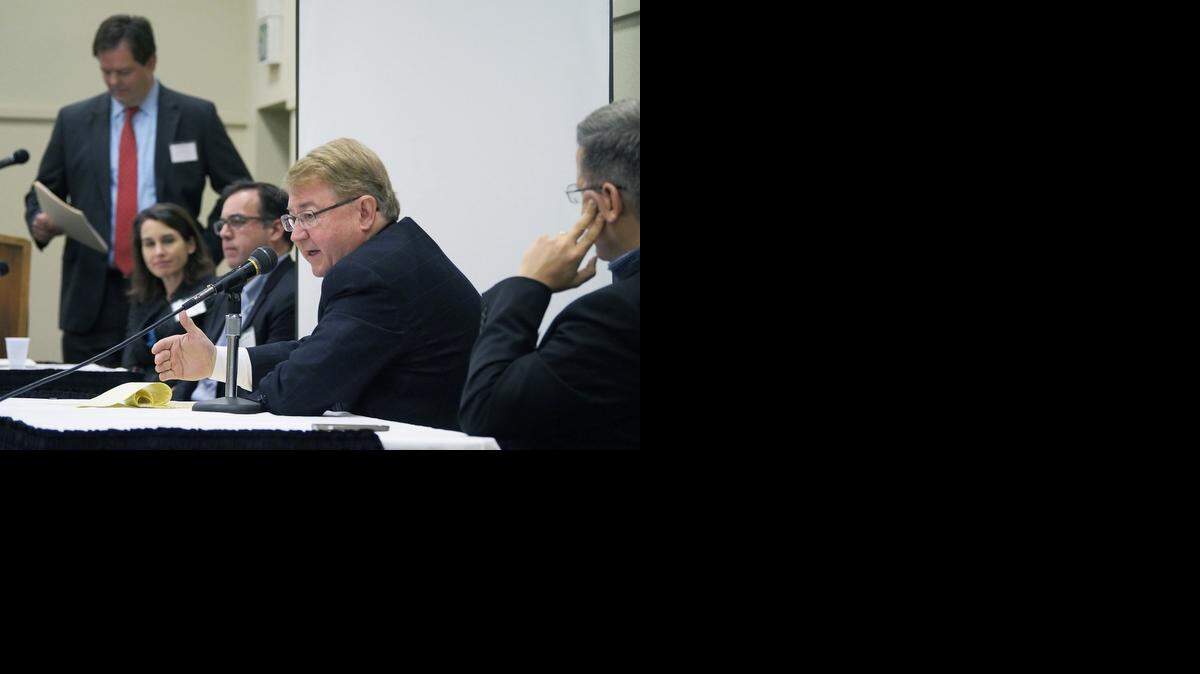 
Mike Ammann, center, president and CEO of the San Joaquin Partnership, speaks as a panelist at the North  San Joaquin Valley Regional Economic Assessment Conference on Nov. 19, 2014, at Modesto Centre Plaza.
