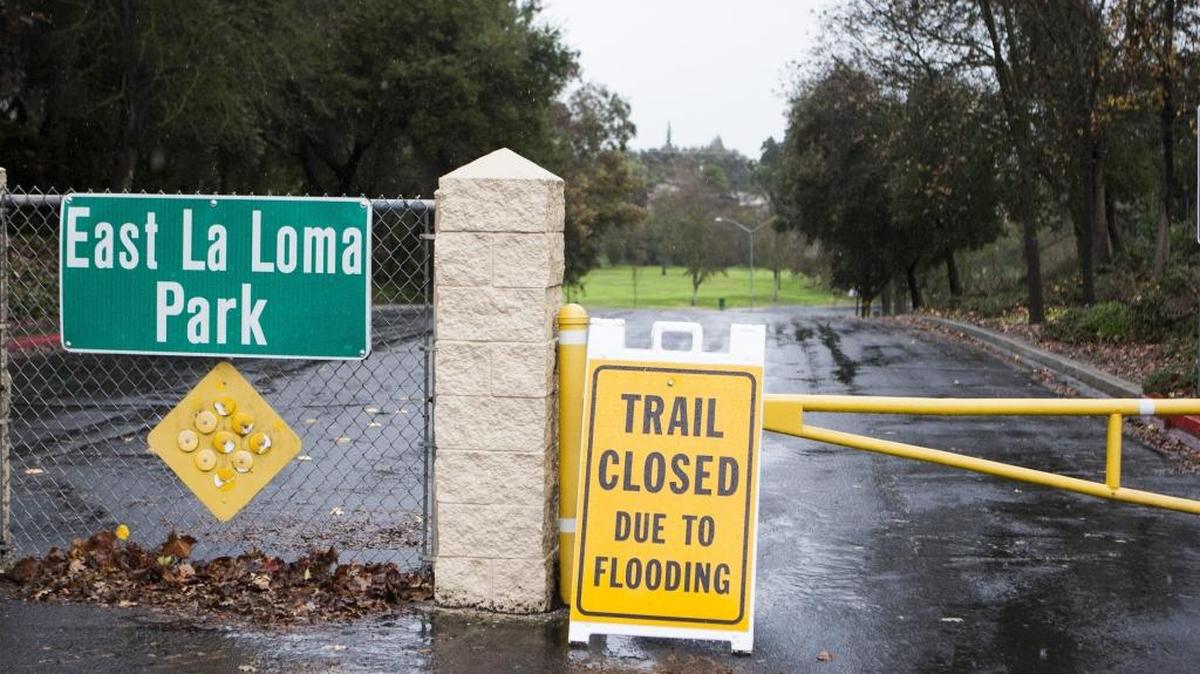 East La Loma Park was closed off by the city of Modesto due to the possibility of flooding along the trail. Rain blanketed the Central Valley Sunday causing puddles and flooding of some roads Jan. 8, 2017.