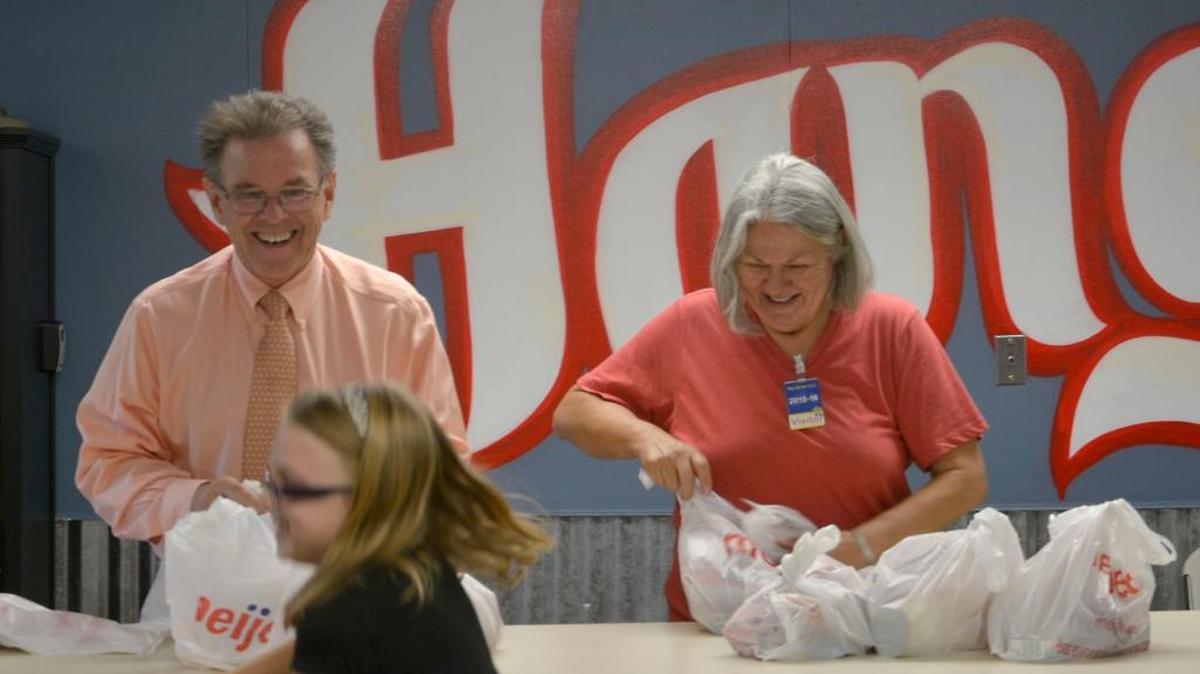 
Modesto's mayor Garrad Marsh and his wife Dallas at Big Valley Elementary School, pack bags full of food for kids Thursday (09-17-15) who might otherwise go hungry on the weekend when they don’t have school lunches. The national nonprofit Blessings in a Backpack provides weekend food to children in the National School Lunch Program.
