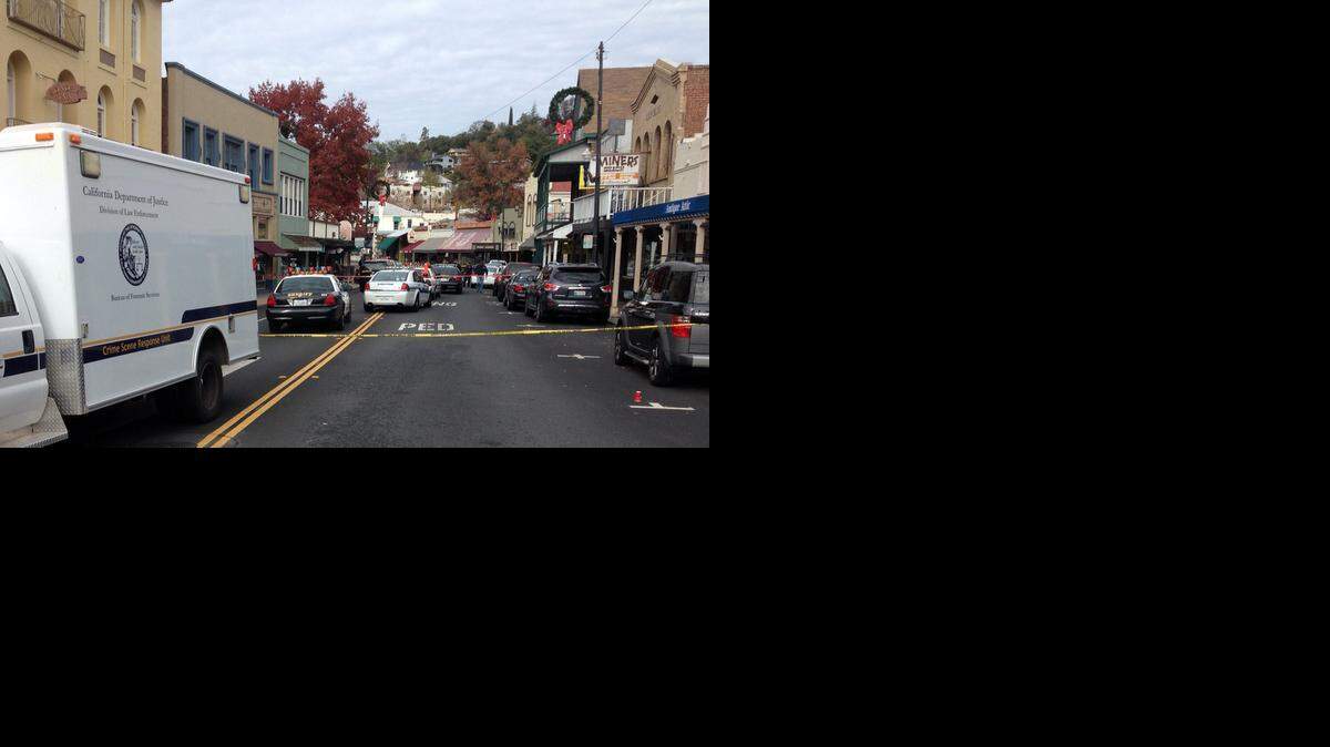 
Authorities work Sunday morning at the scene of a shooting on Washington Street in downtown Sonora. Bruce Thomas Snyder was killed by police after leading authorities on a three-mile pursuit Saturday evening.
