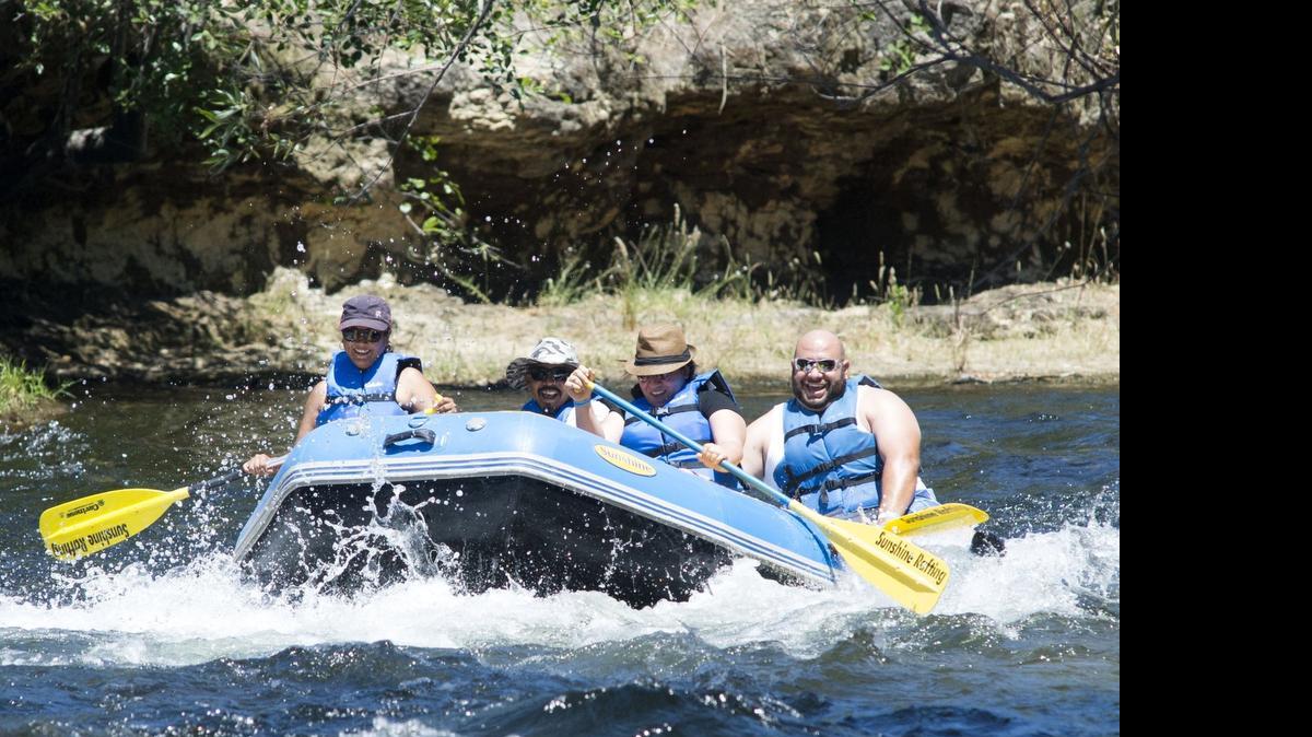 
Four people enjoy their time rafting on the Stanislaus River with Sunshine Rafting Adventures in Knights Ferry on Sunday.
