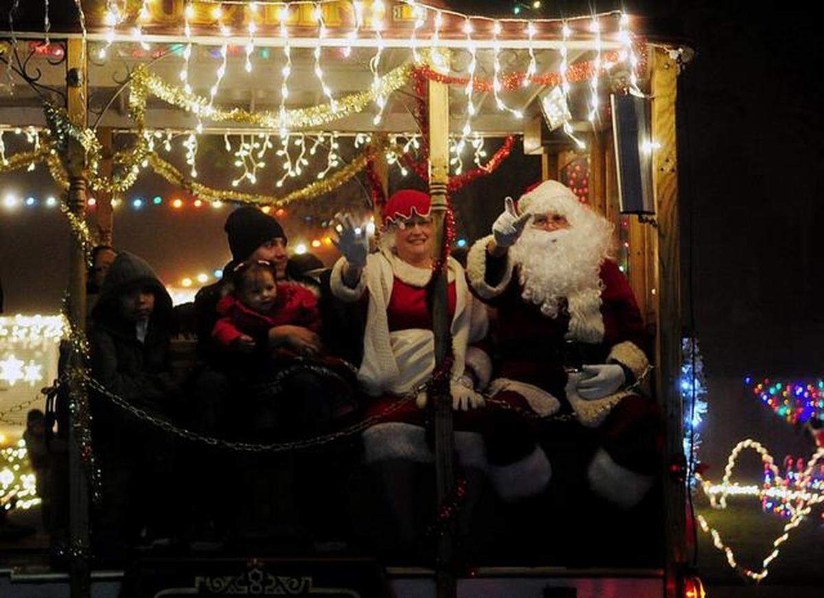 Santa Claus and Mrs. Claus wave to the crowd along Henry Avenue in Ceres during the 25th annual Christmas Tree Lane opening and festival in 2012.