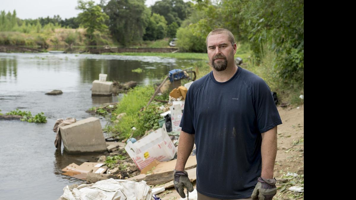 
Chris Guptill, seen just west of the Ninth Street Bridge in Modesto last week, organized a monthly Tuolumne River cleanup project called 9-2-99.

