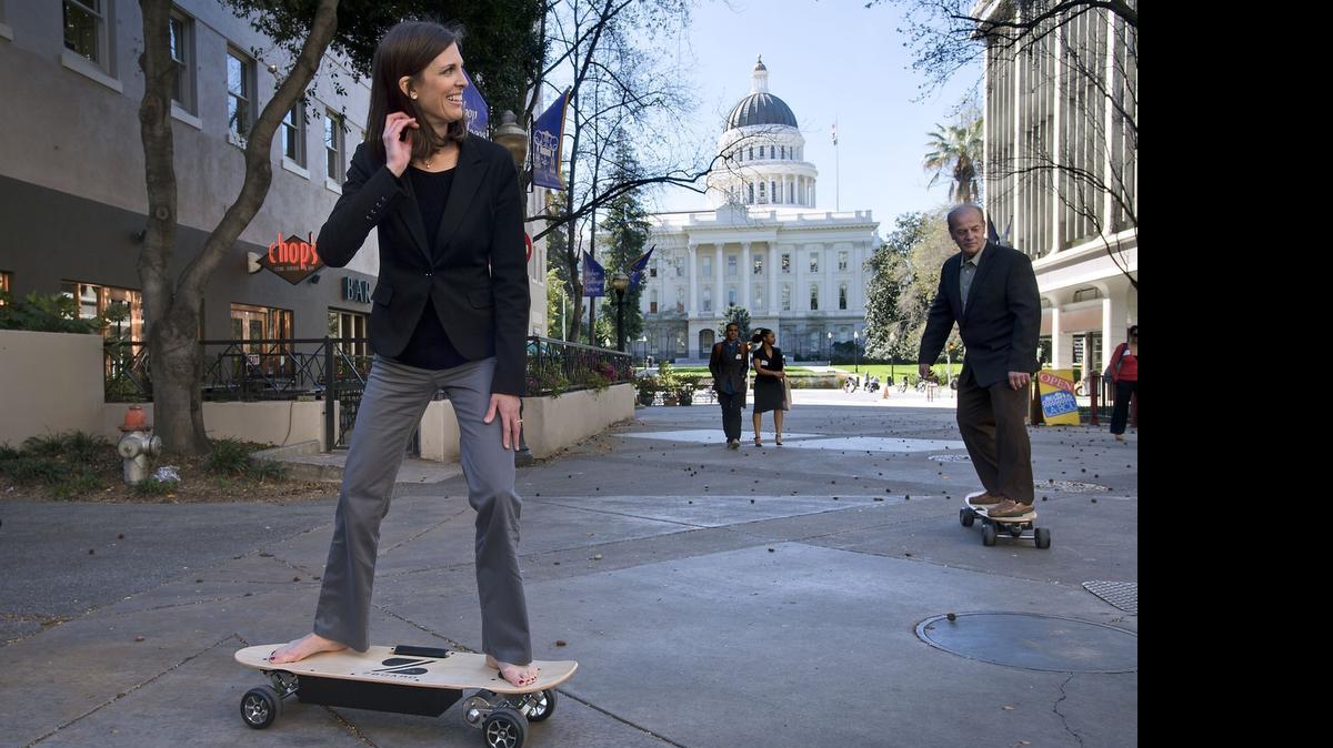 
Assemblywoman Kristin Olsen, R-Riverbank, rides an electrically powered skateboard called a ZBoard during a press event near the state Capitol in Sacramento on March 11, 2014. 
