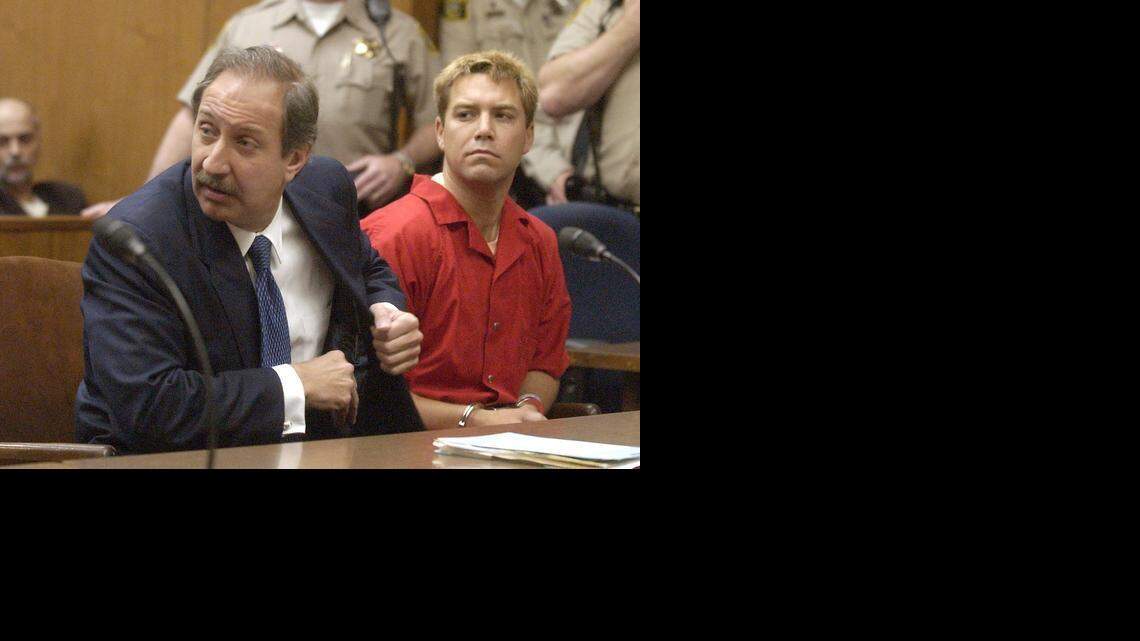 
Defense attorney Mark J. Geragos looks at prosecutors while seated next to client Scott Peterson in Stanislaus Superior Court during a hearing in May 2003 in Modesto. 
