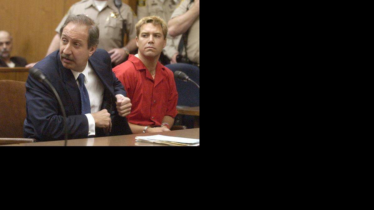 
Defense attorney Mark J. Geragos looks at prosecutors while seated next to client Scott Peterson in Stanislaus Superior Court during a hearing in May 2003 in Modesto. 
