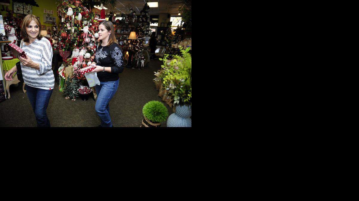 
Mother and daughter Georgia Wight and Tiffany Rivas shop together at Farmers Daughter on Friday afternoon in McHenry Village in Modesto.
