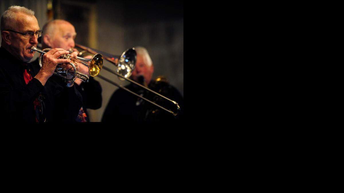 
From left, Dick Williams on cornet, Carl Reiley on trombone and Don Irving on bass sax play with the Bye Bye Blues Band from Monterey on Saturday at the Clarion Hotel in Modesto.
