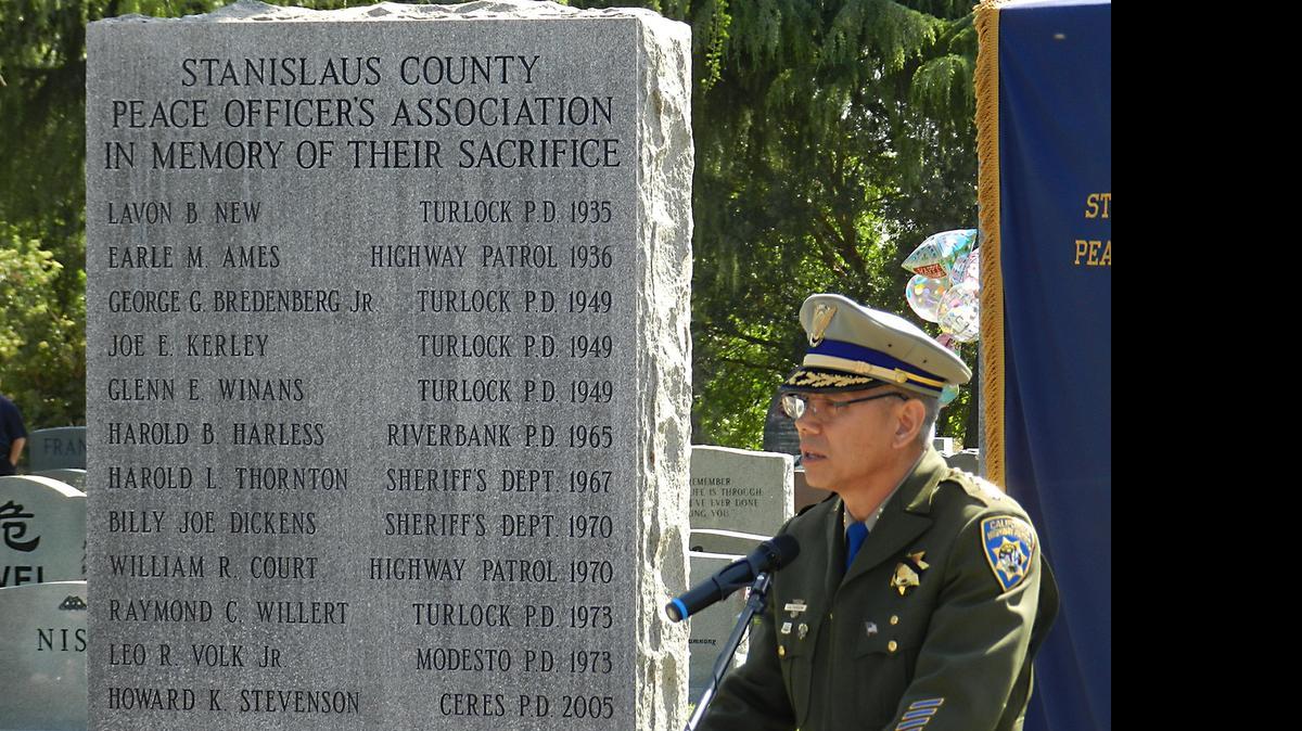 
California Highway Patrol Commissioner Joe Farrow speaks at the Stanislaus County Peace Officers Association memorial service Wednesday at Lakewood Memorial Park in Hughson.
