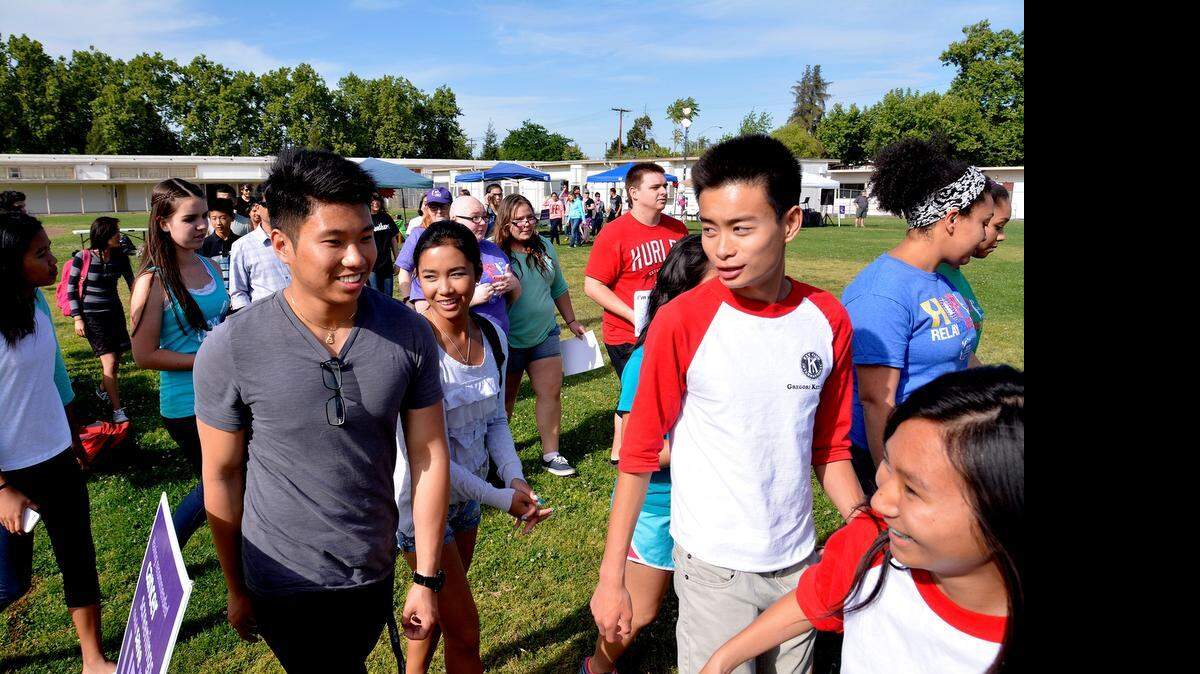 
High school students from three area campuses – Beyer, Downey and Modesto – walk in the Modesto High Relay for Life fundraising event on Friday.
