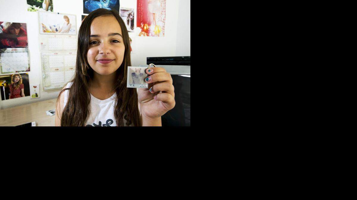 
Waterford resident Emily Gutierrez, 12, is wrapped up in the music and life of musician Taylor Swift. As a reward for her dedication as a fan, Gutierrez was invited as a guest to the superstar’s secret session at her home in Southern California. Gutierrez shows off a Taylor Swift key chain in Waterford, Calif., on Saturday, Nov. 1, 2014.
