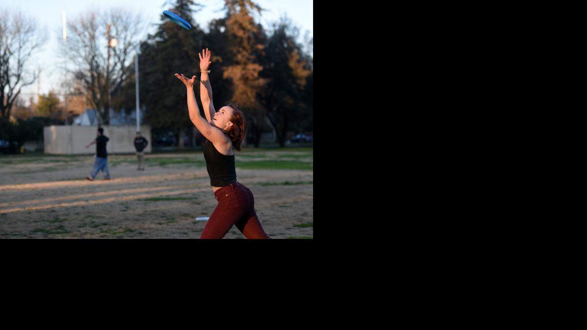 
Breezy Gunnarson of Modesto reaches up to catch a flying disc on Thursday afternoon  at Enslen Park. Modestans got a break from the cloudy, foggy weather when the sun made an appearance and the temperature rose.
