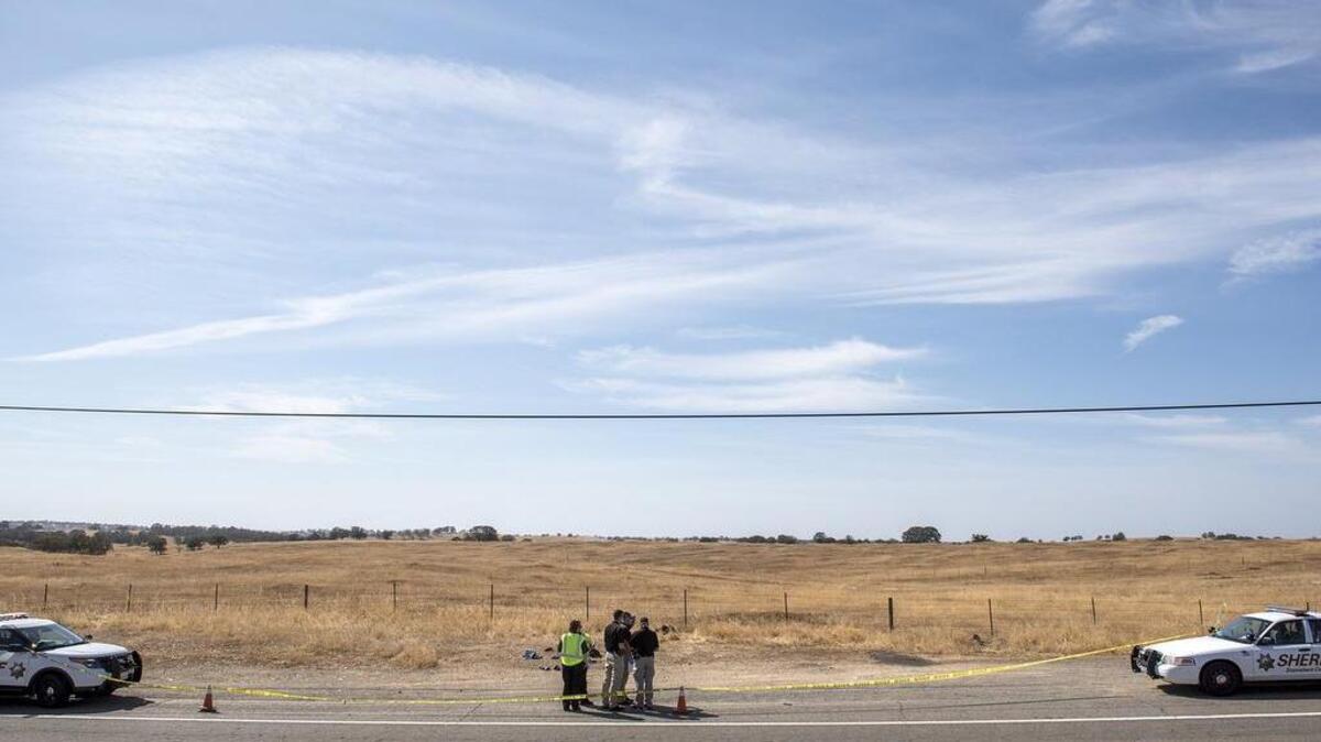 
Stanislaus County sheriff’s detectives investigate a body found on La Grange Road near Cooperstown Road on Wednesday, Oct. 7, 2015.

