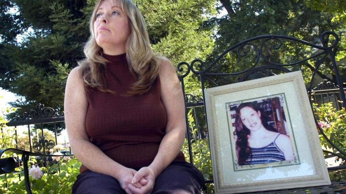 Boni Driskill shows a photo of her daughter, Lacy Ferguson, who was shot and killed in Modesto. Ferguson was a bystander in a possible gang-related shooting Aug. 24, 2003. Driskill is pictured here Aug. 20, 2009.