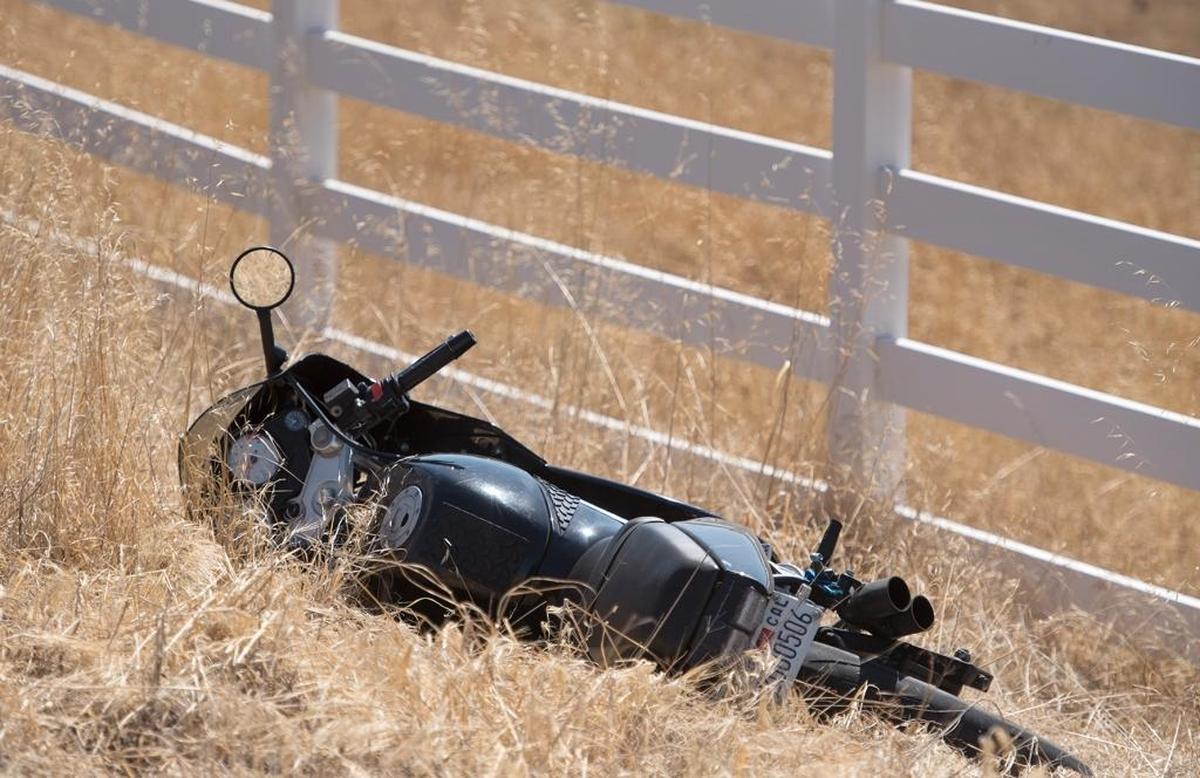 An abandoned motorcycle is being investigated as part of a homicide on La Grange Road near Cooperstown Road in La Grange, Calif., on Wednesday, October, 7, 2015.