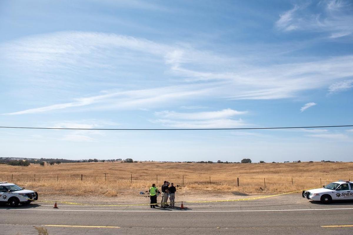 Stanislaus County Sheriff’s detectives investigate a homicide on La Grange Road near Cooperstown Road in La Grange, Calif., on Wednesday, October, 7, 2015.