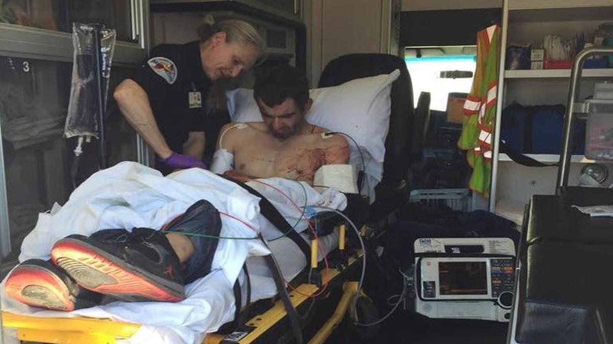 
An emergency responder tends to burglary suspect Shawn Majors, 38, of Oakdale on Wednesday. 
